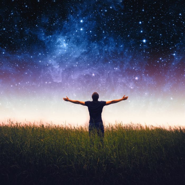 Silhouette of man and stars sky. Elements of this image furnished by NASA