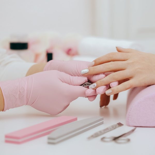 Manicurist does manicure